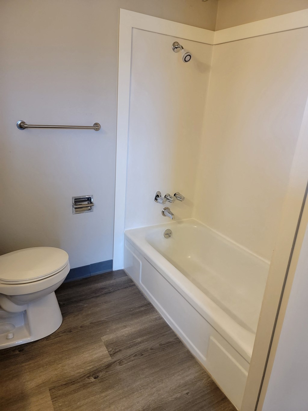 a small bathroom with a toilet and a bathtub