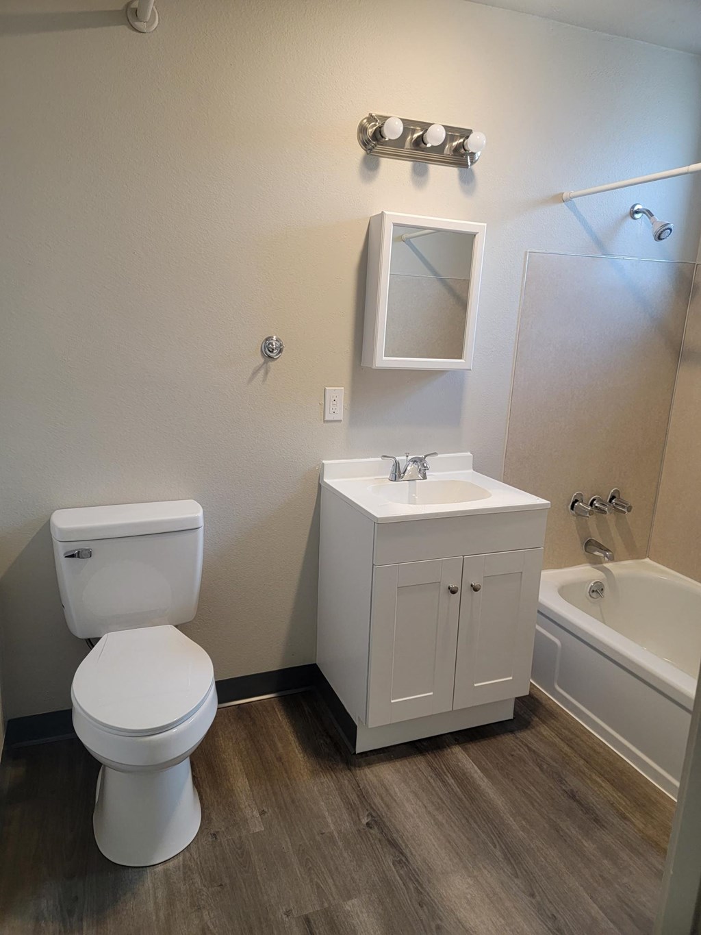 a bathroom with a toilet sink and bathtub