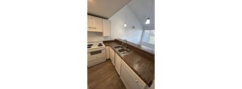 Kitchen with white cabinets and appliances