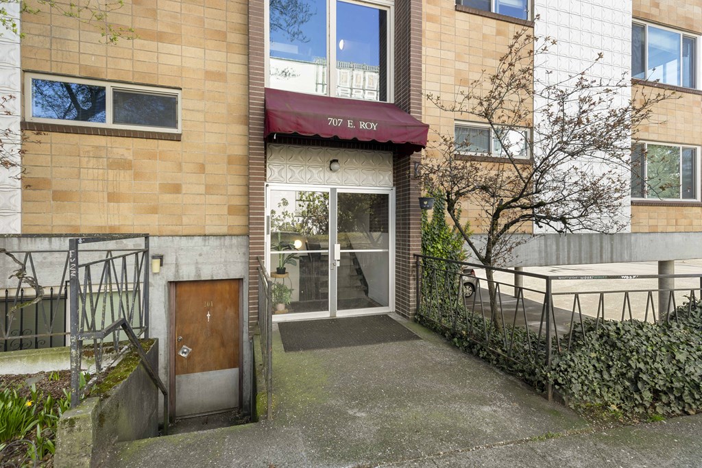 the entrance to a building with a wooden door