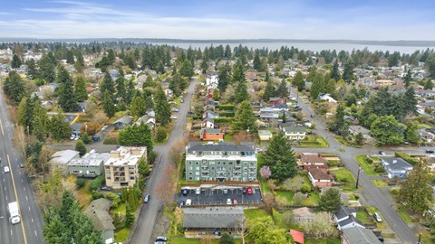 an aerial view of a city with houses and trees