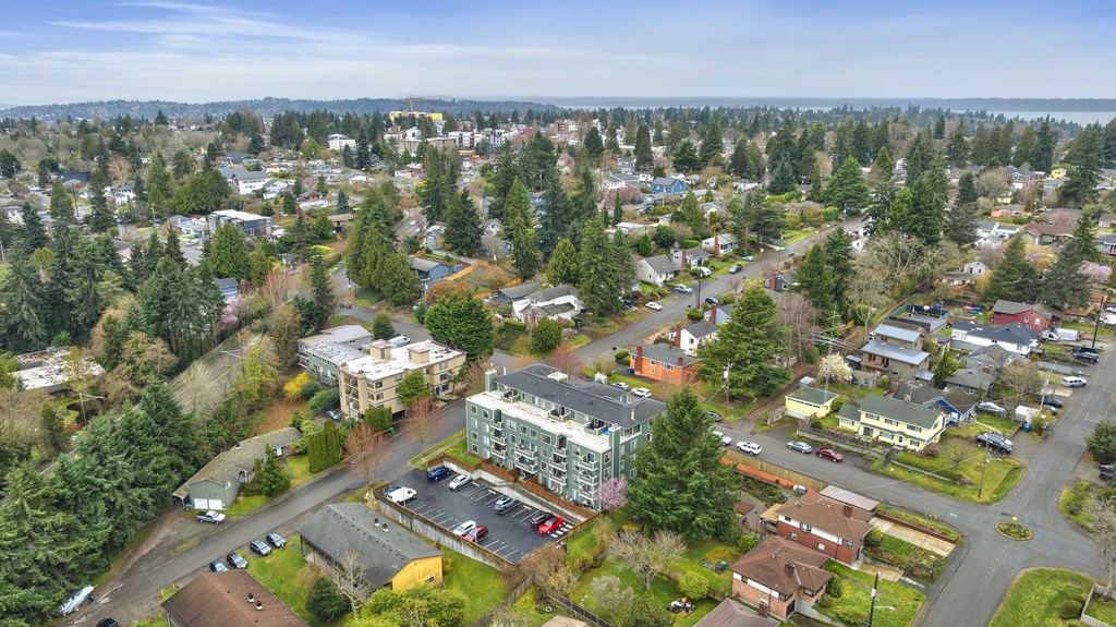 an aerial view of a city with trees and buildings