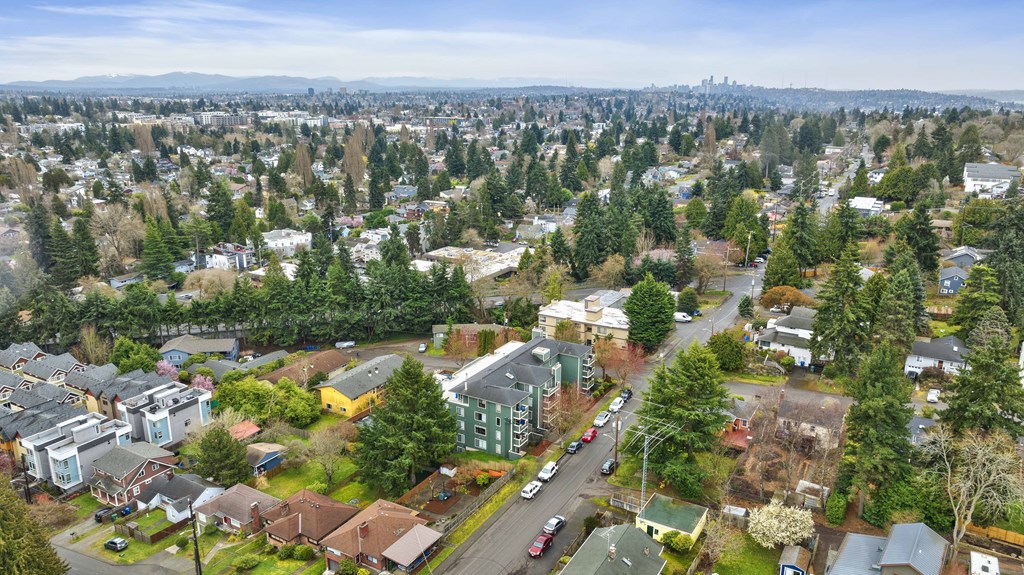 an aerial view of a city with houses and trees