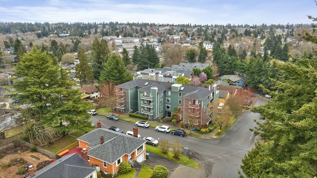 an aerial view of a city with buildings and trees