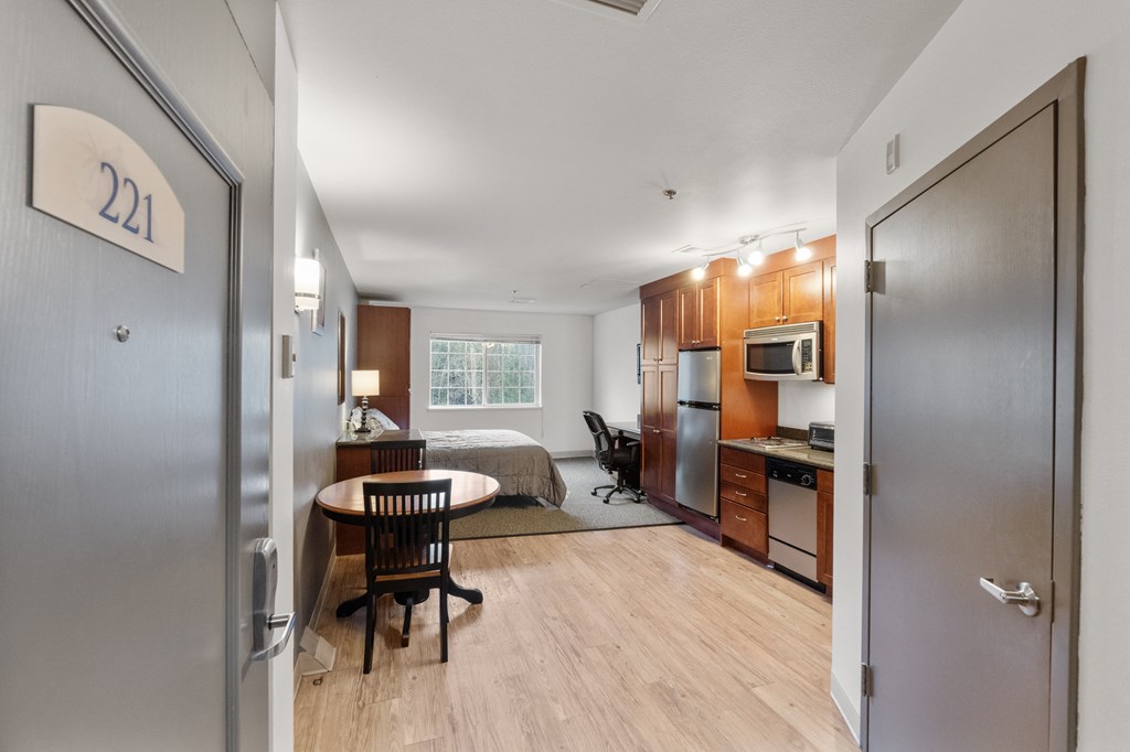 an apartment with a bedroom and a kitchen and a living room