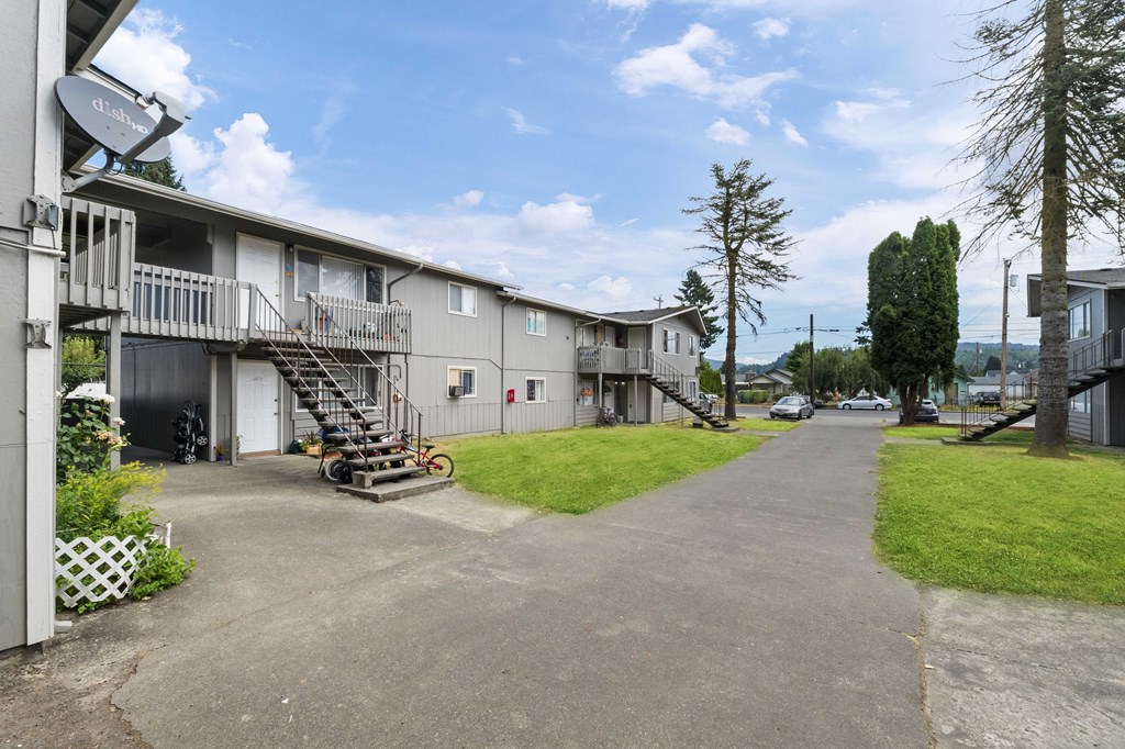 this is a photo of the parking lot at the whispering winds apartments in pearland, tx