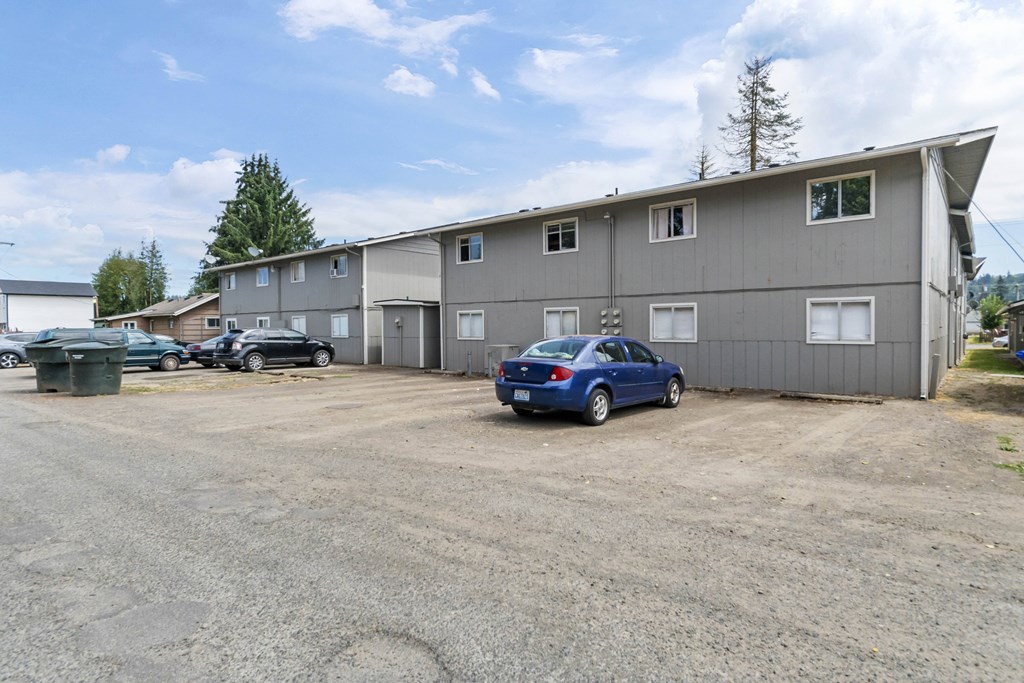 a large building with a parking lot in front of it