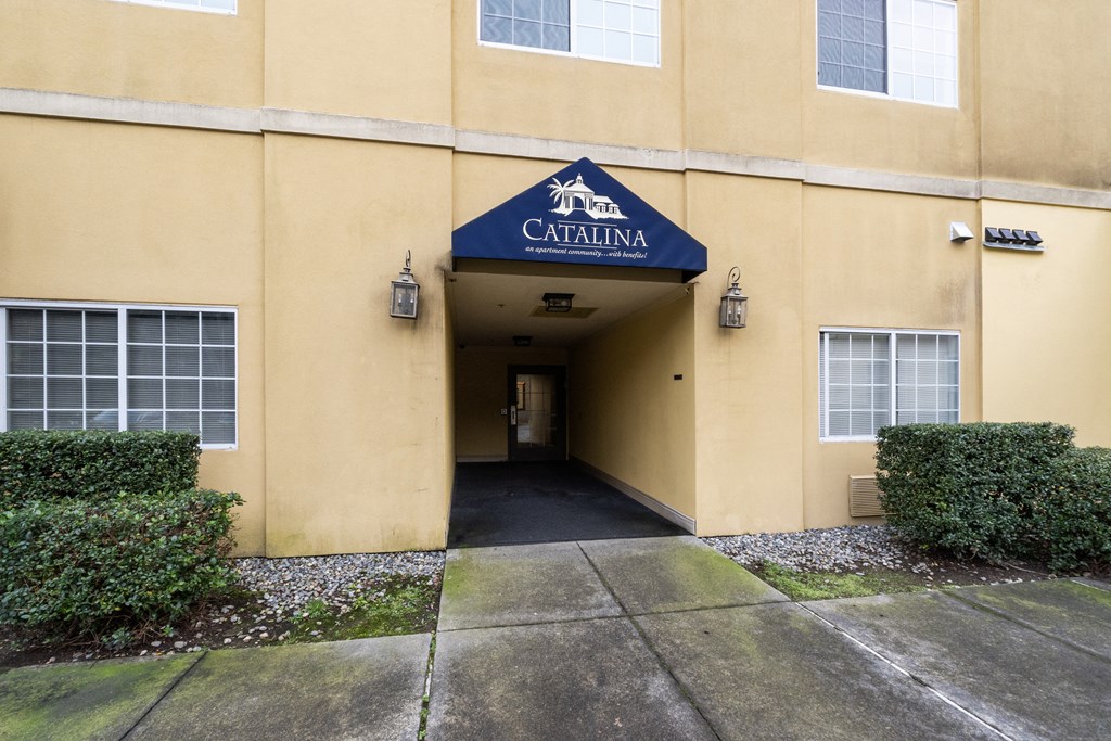 the entrance to a yellow building with a blue sign that reads citigroup