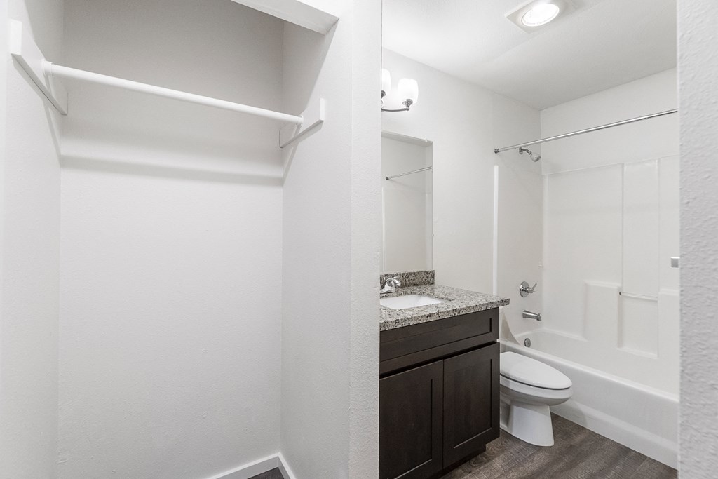 an empty bathroom with a toilet and a sink