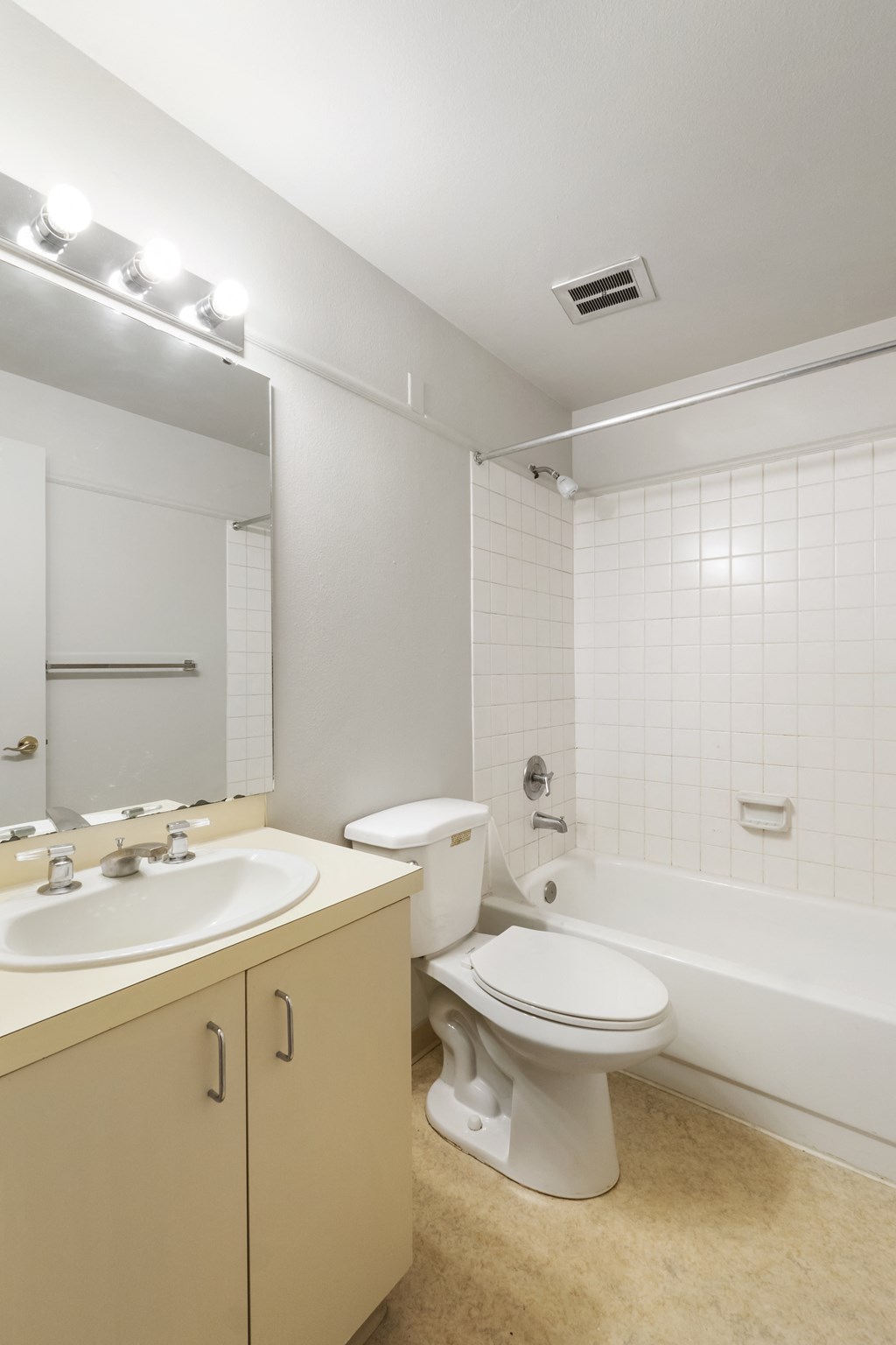 a bathroom with a toilet and a sink and a bath tub