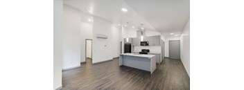 a kitchen and living room in a 555 waverly unit