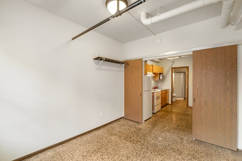 A kitchen area with a refrigerator, microwave, and oven.