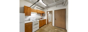 Studio kitchen with refrigerator, microwave, oven & range