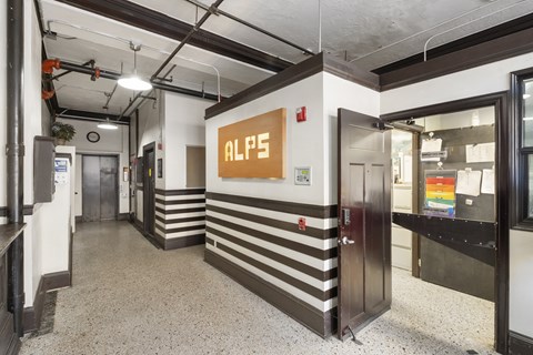 A hallway with a sign that says
