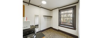 Studio #1 living space with cooking area, refrigerator, microwave