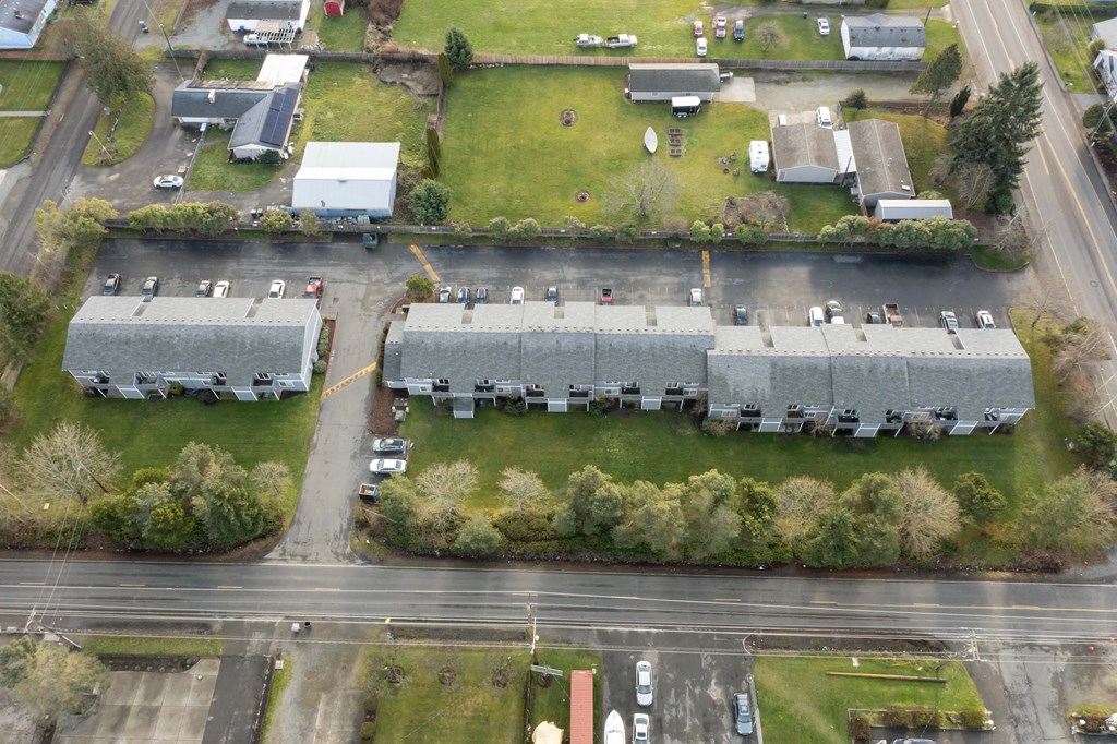an aerial view of a group of buildings and a road