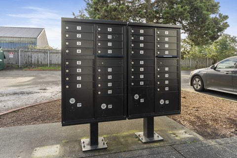 a row of mailboxes on the side of a street
