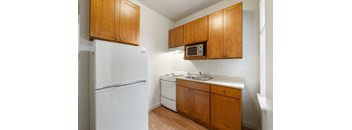 Studio kitchen with refrigerator, microwave, oven & range