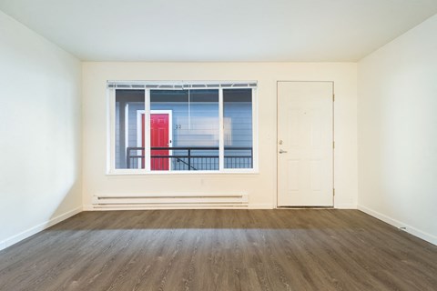 A room with a red door and a white door.