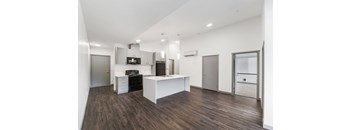 a kitchen and dining area in a 555 waverly unit