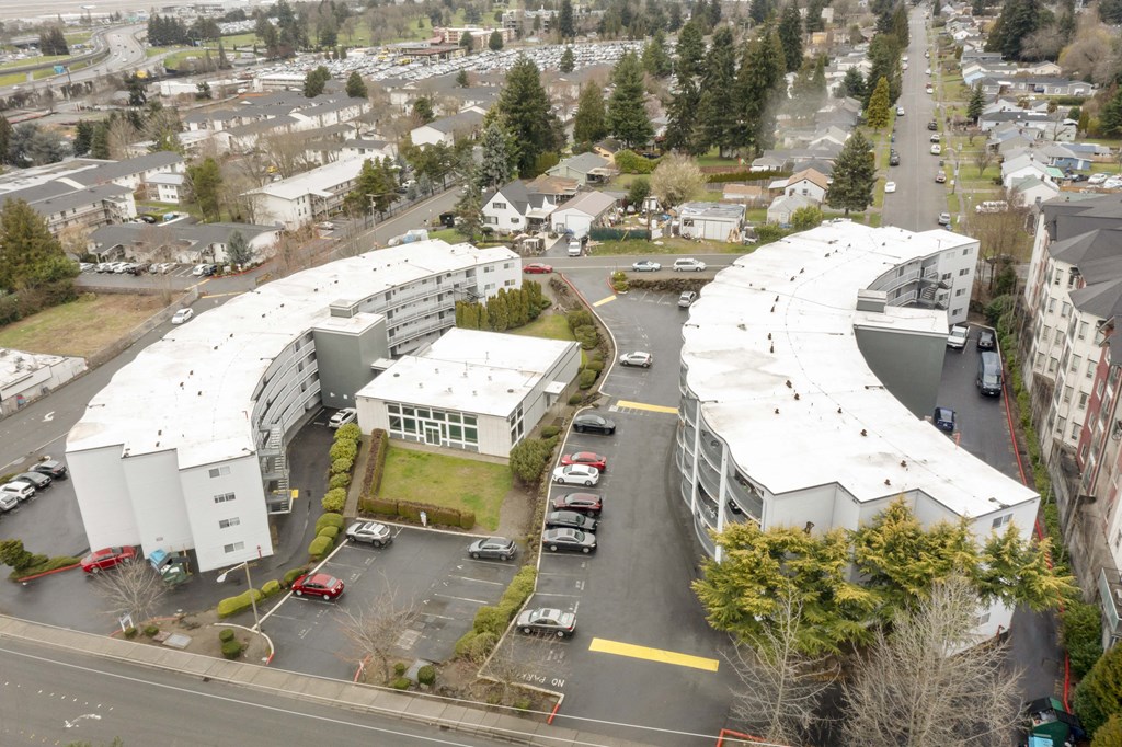 an aerial view of a building with a curved roof