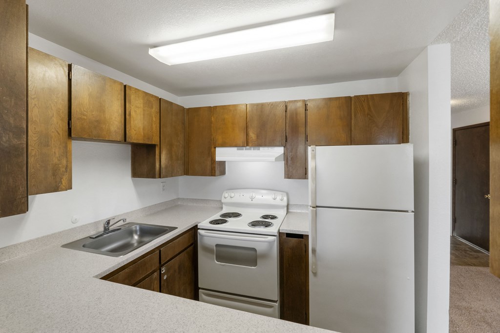 the preserve at ballantyne commons apartment kitchen with stove refrigerator and sink