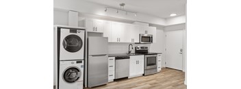 Modern studio kitchen with stainless steel appliances