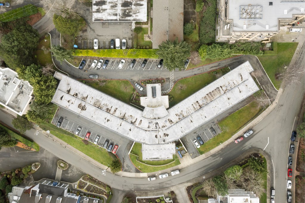 an aerial view of a building with a round road