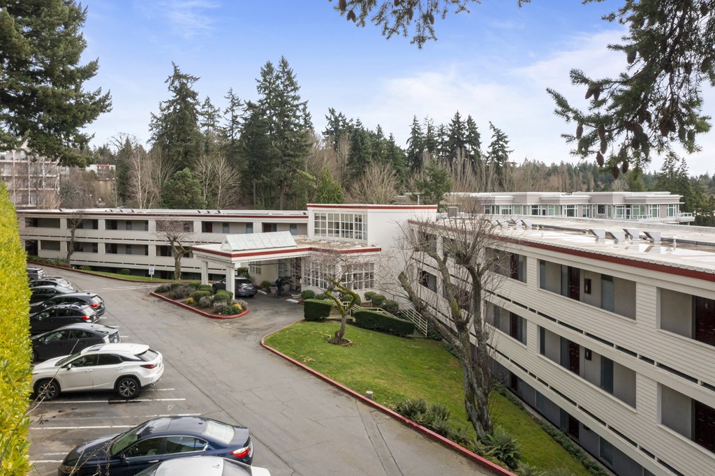 the building where the hotel is located is shown from the parking lot