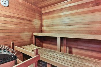 a sauna with benches and a table