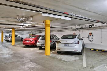 a parking garage with cars parked in it