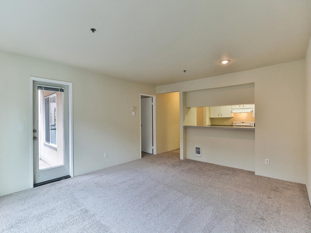 an empty room with pink and purple lights on the walls