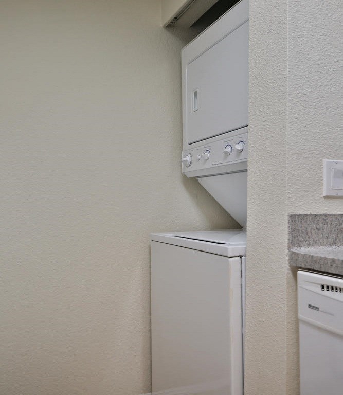 a laundry room with a washer and dryer in it