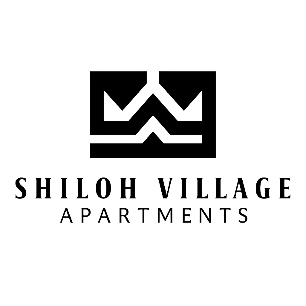 Shiloh Village Apartments logo on a grey background.