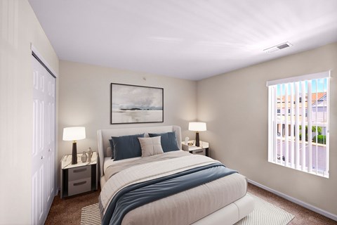 A bedroom with a large bed and a painting on the wall.