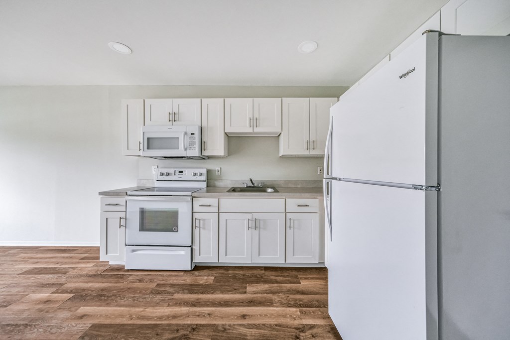 Kitchen with appliances at Amity Senior, Amityville, NY