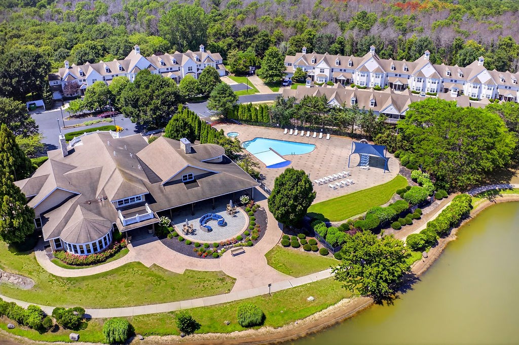 A large house with a pool in the backyard.