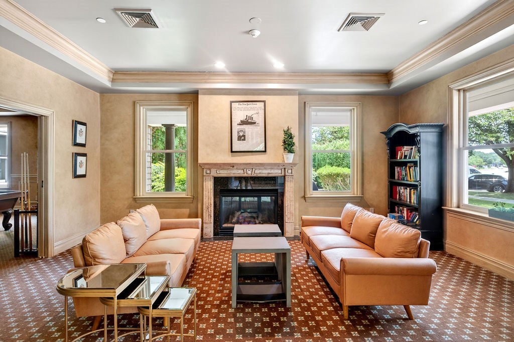 A living room with a fireplace and a couch.