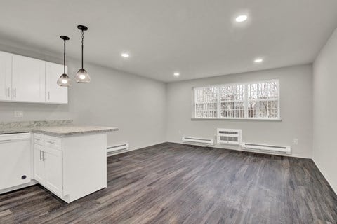 Kitchen lights and appliances with cabinets near living room at Oakwood Manor, Bay Shore, NY, 11706