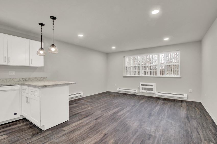 Kitchen lights and appliances with cabinets near living room Kitchen lights and appliances with cabinets near living room at Oakwood Manor, Bay Shore, NY, 11706