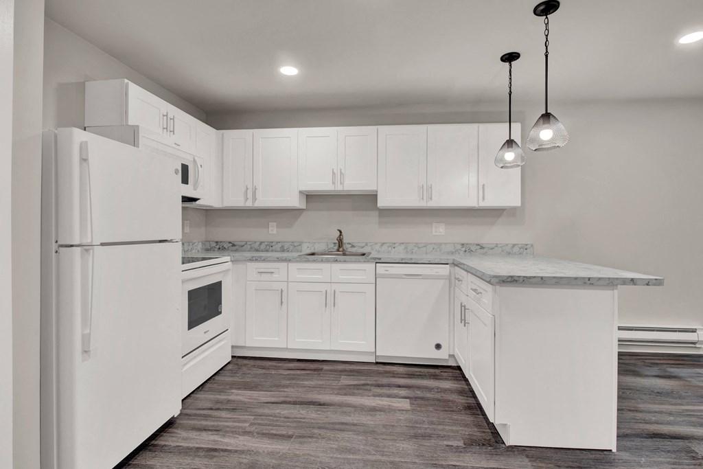 Kitchen lights and appliances with cabinets at Oakwood Manor, New York, 11706