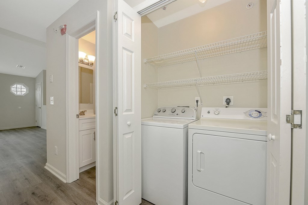 a laundry room with a washer and dryer  at Platt Gardens, West Babylon, NY