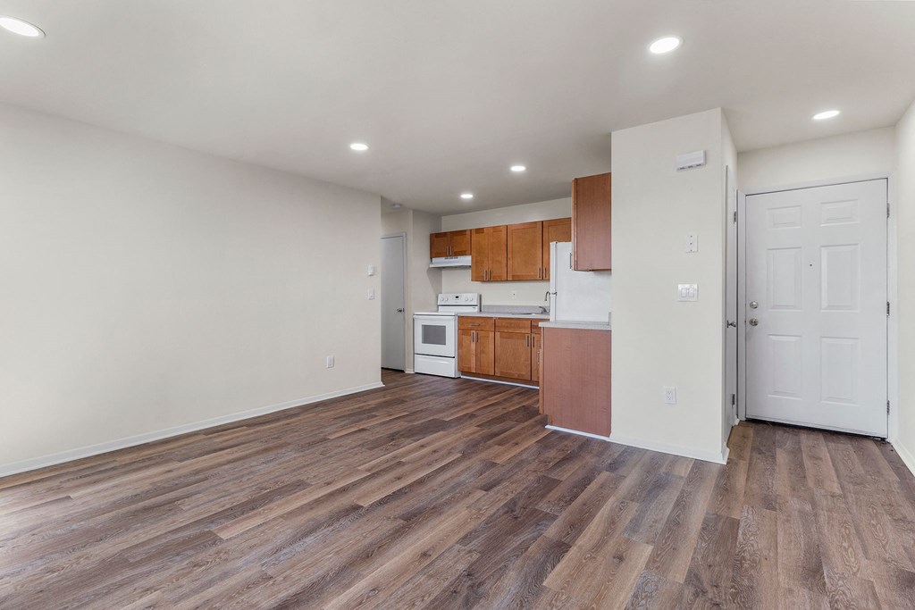 Wooden cabinets in kitchen and living room at Oakwood Manor, New York