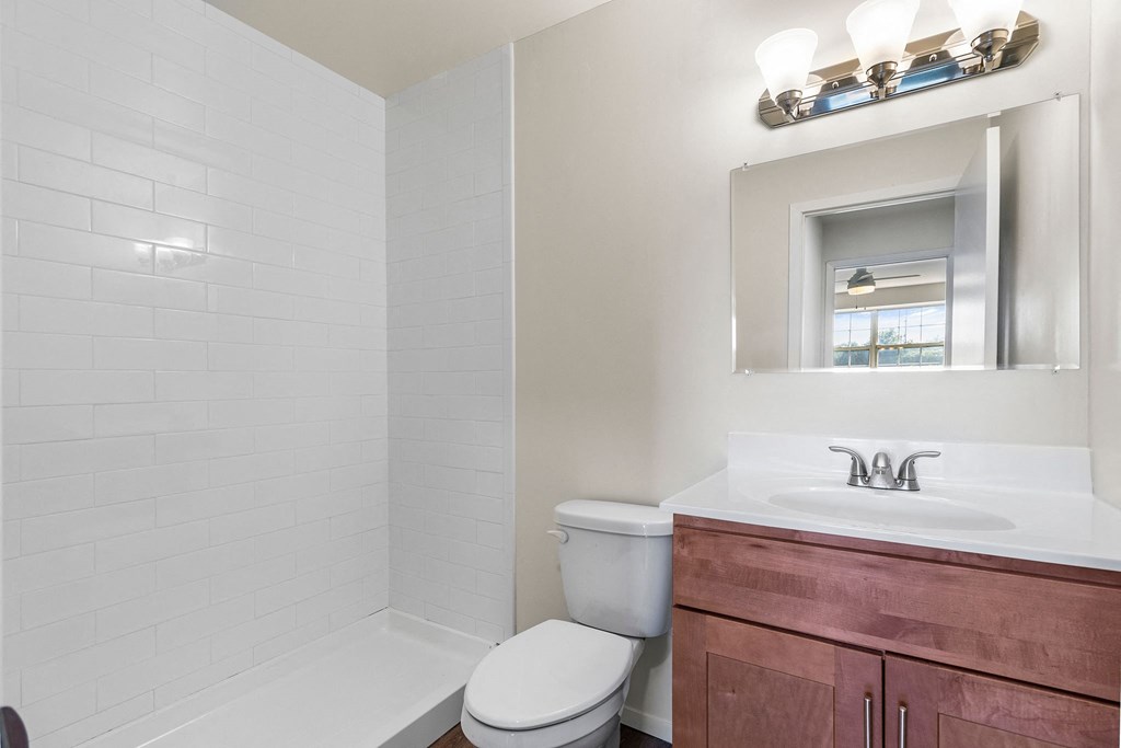 Wooden cabinets in bathroom at Oakwood Manor, Bay Shore, New York