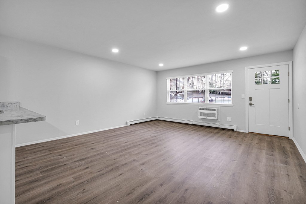 Living room with window at Amity Oak, Amityville