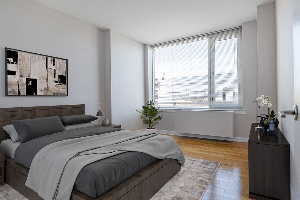 an apartment bedroom with a bed and a large window at 34 Berry, Brooklyn, NY, 11249 an apartment bedroom with a bed and a large window at 34 Berry, Williamsburg, Brooklyn, NY