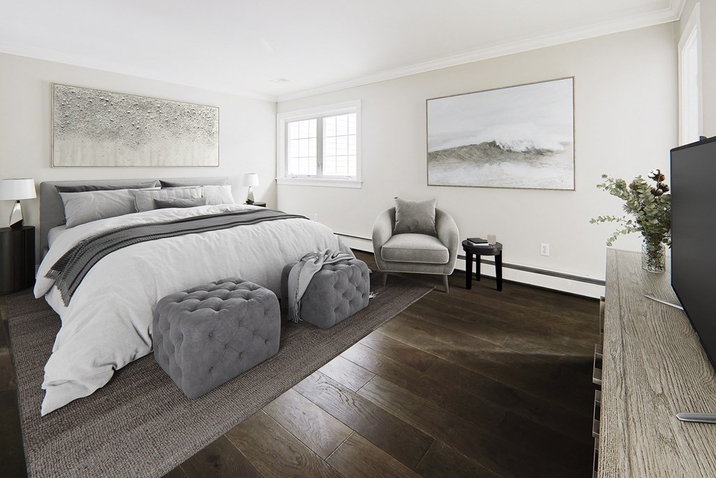 Newly renovated bedroom with new flooring, paint