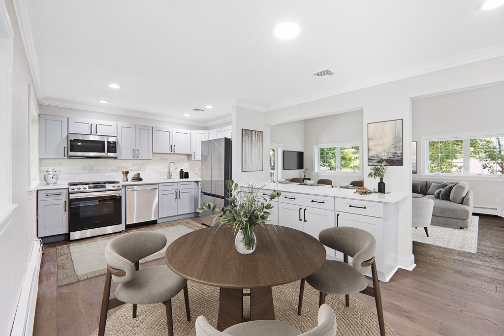 Newly renovated apartment home with open concept floor plan, new cabinets, new quartz countertops, stainless steel appliances, new flooring, paint