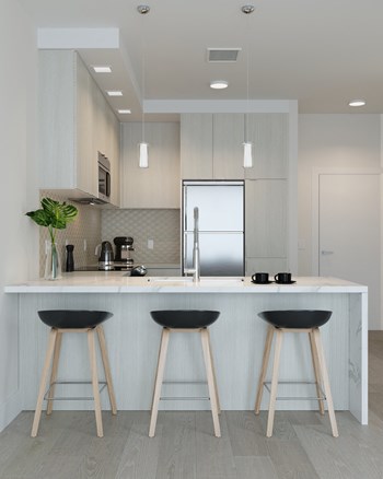 Kitchen with Light Finishes featuring Island Kitchen with Light Finishes featuring Island at Arrowwood Apartments, Maryland - Photo Gallery 6