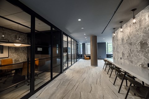 a meeting room with a long table and chairs